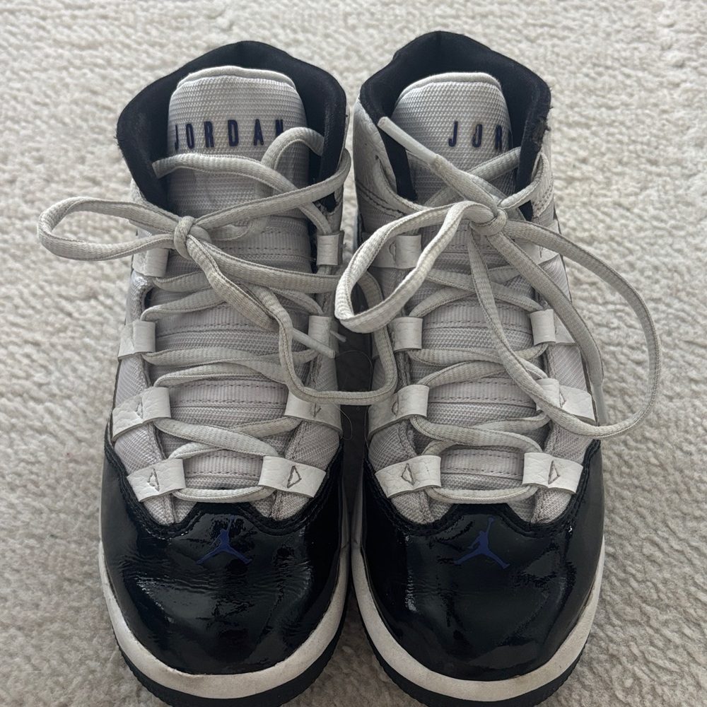 Jordan Kids Black and White Sneakers with Blue Accents